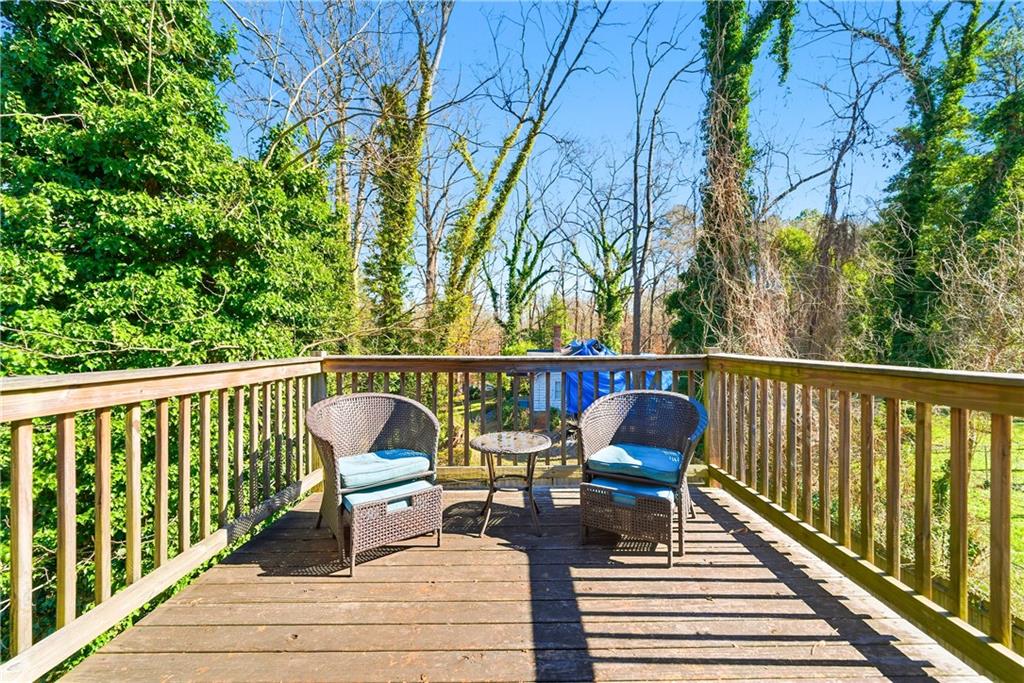 902 Gaston Street Southwest Atlanta, GA 30310 - Photo 34 of 36 a balcony with wooden floor potted plants and outdoor seating
