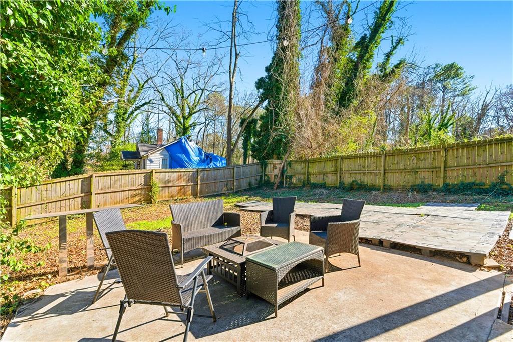 902 Gaston Street Southwest Atlanta, GA 30310 - Photo 35 of 36 a backyard of a house with table and chairs