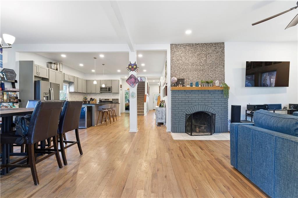 902 Gaston Street Southwest Atlanta, GA 30310 - Photo 4 of 36 a living room with furniture and a fireplace