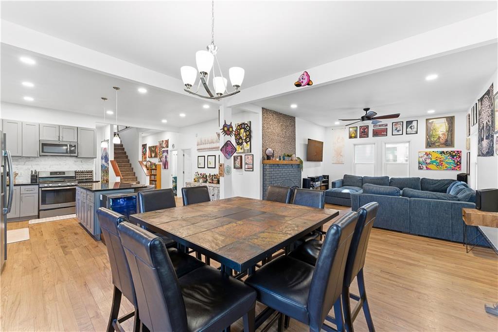 902 Gaston Street Southwest Atlanta, GA 30310 - Photo 5 of 36 a view of a dining room with furniture and wooden floor