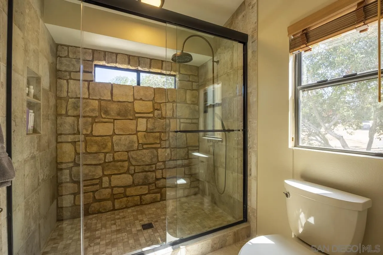 1603 Camino Del Sequan Alpine, CA 91901 - Photo 11 of 48 a bathroom with a shower and toilet