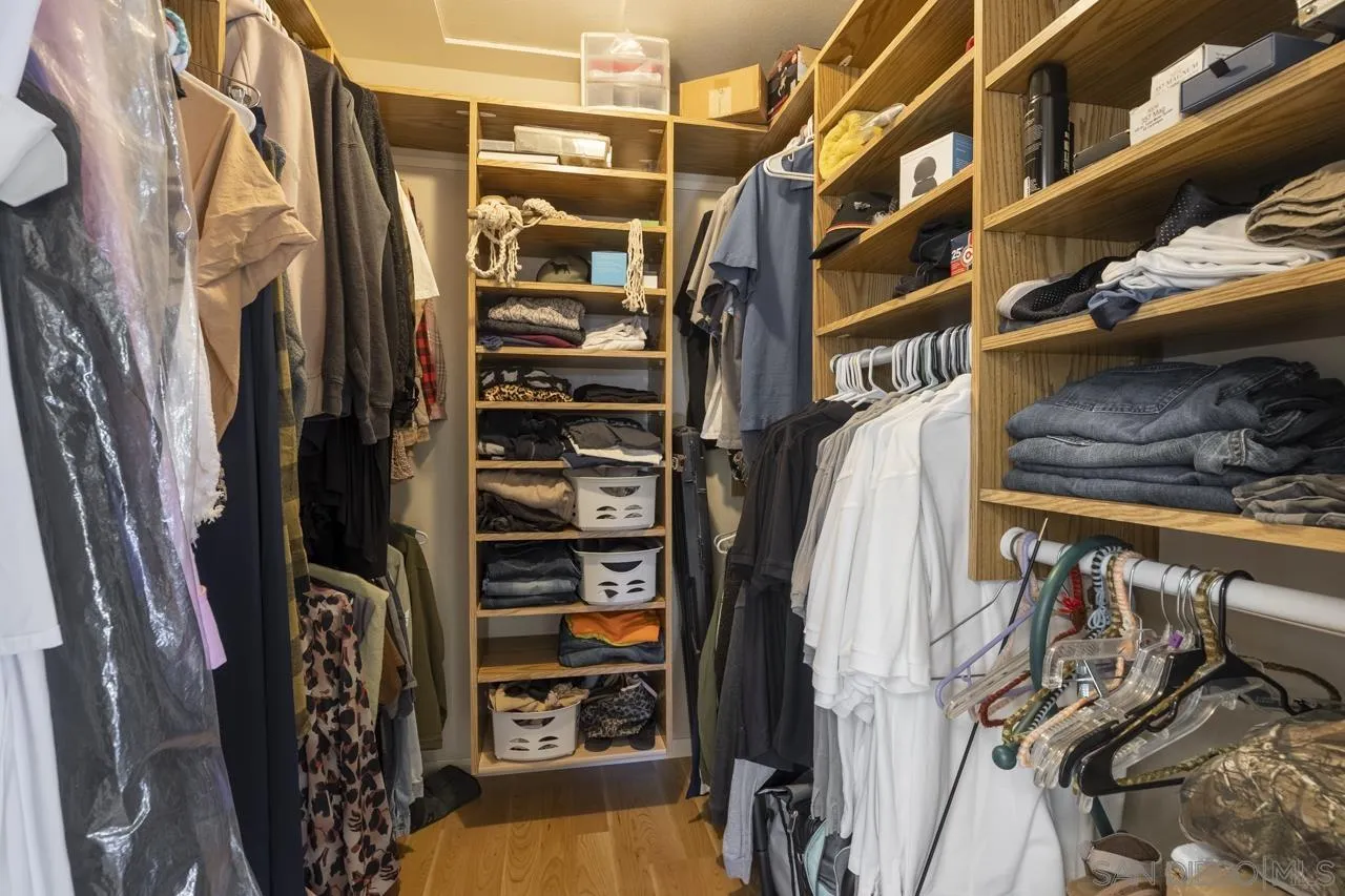 1603 Camino Del Sequan Alpine, CA 91901 - Photo 13 of 48 a view of walk in closet with clothes and shoes