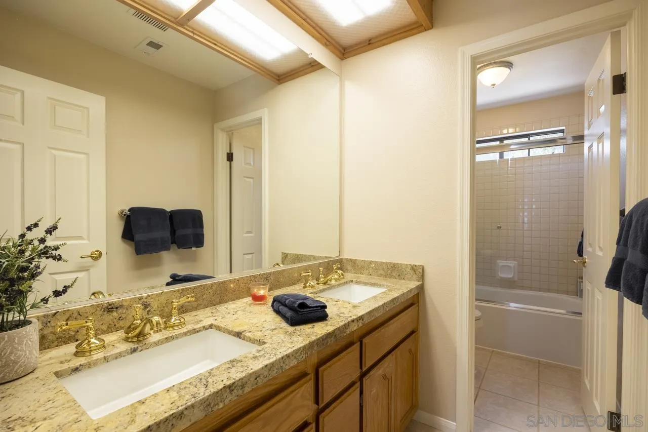 1603 Camino Del Sequan Alpine, CA 91901 - Photo 16 of 48 a bathroom with a sink and a mirror