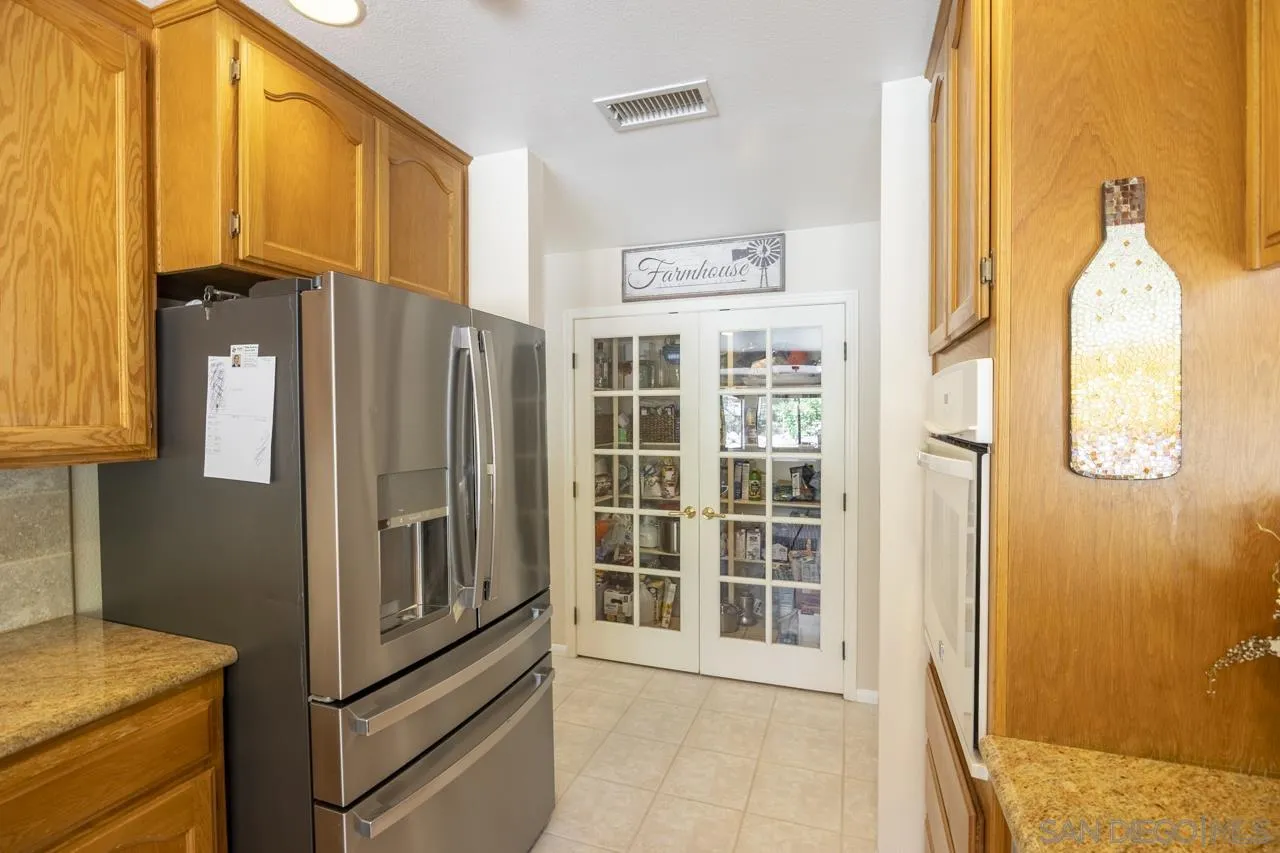1603 Camino Del Sequan Alpine, CA 91901 - Photo 27 of 48 a view of a refrigerator and window