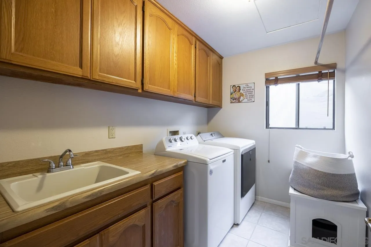 1603 Camino Del Sequan Alpine, CA 91901 - Photo 30 of 48 a utility room with sink dryer and washer