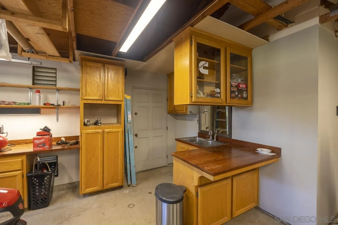 1603 Camino Del Sequan Alpine, CA 91901 - Photo 31 of 48 a kitchen with stainless steel appliances granite countertop a sink a stove and a refrigerator