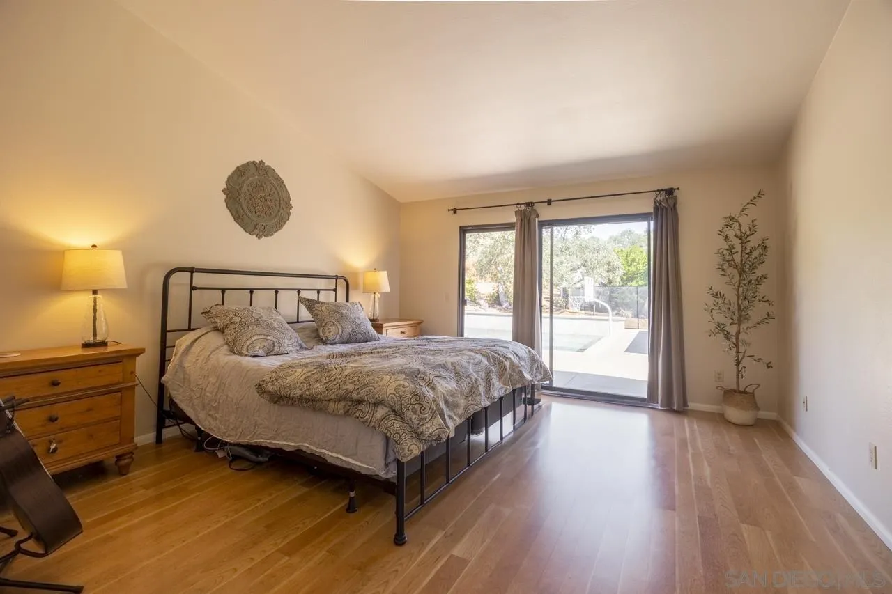 1603 Camino Del Sequan Alpine, CA 91901 - Photo 9 of 48 a bedroom with a bed and a window