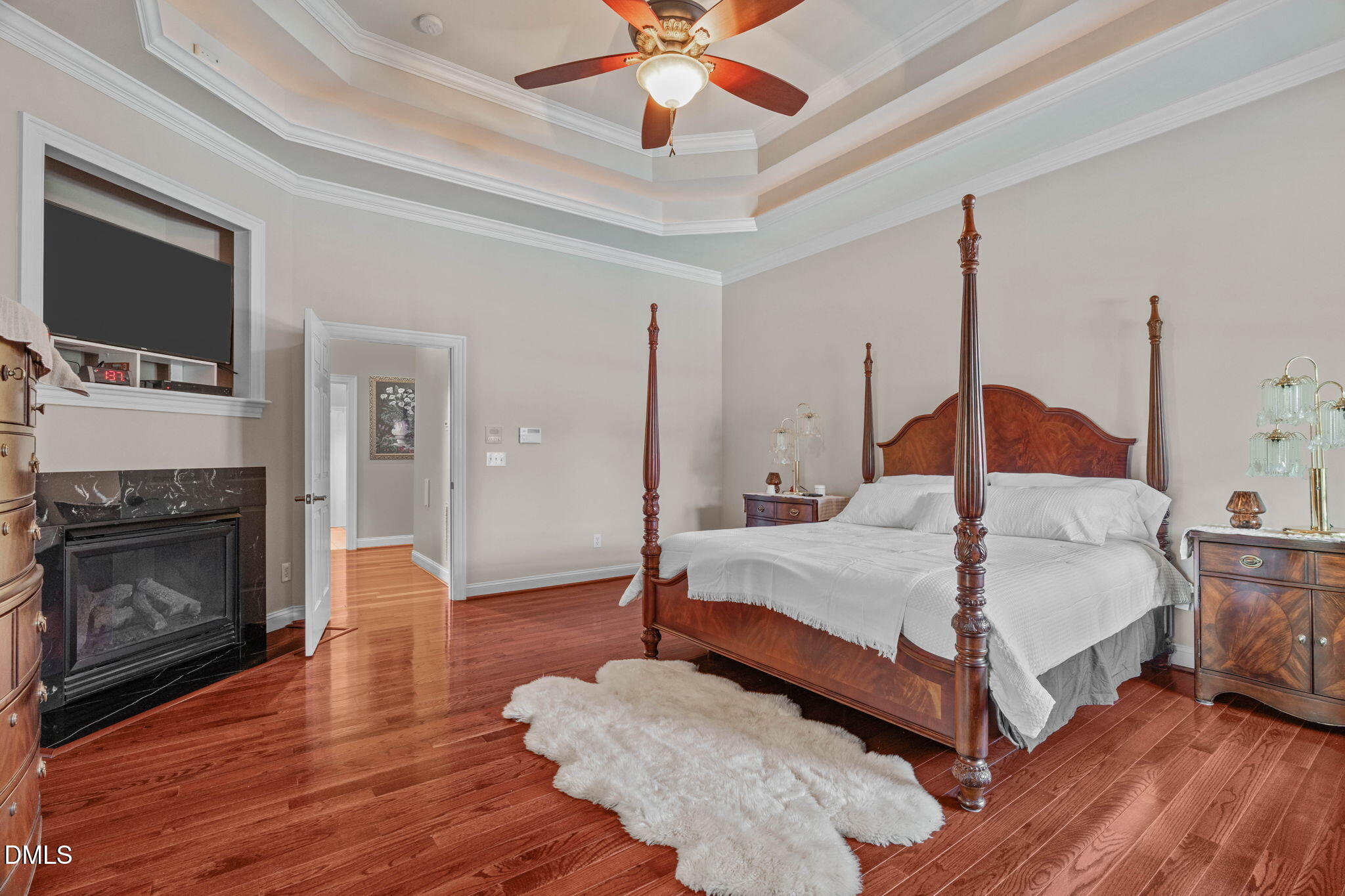 10917 Jordan Road Raleigh, NC 27603 - Photo 21 of 58 a bedroom with a bed and a flat screen tv
