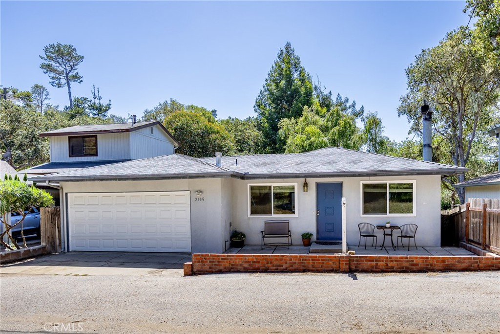 2155 Cowper Street Cambria, CA 93428 - Photo 1 of 35 a front view of a house with a garage