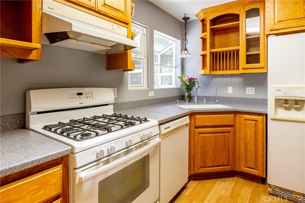 2155 Cowper Street Cambria, CA 93428 - Photo 12 of 35 a kitchen with stainless steel appliances granite countertop a stove and a sink