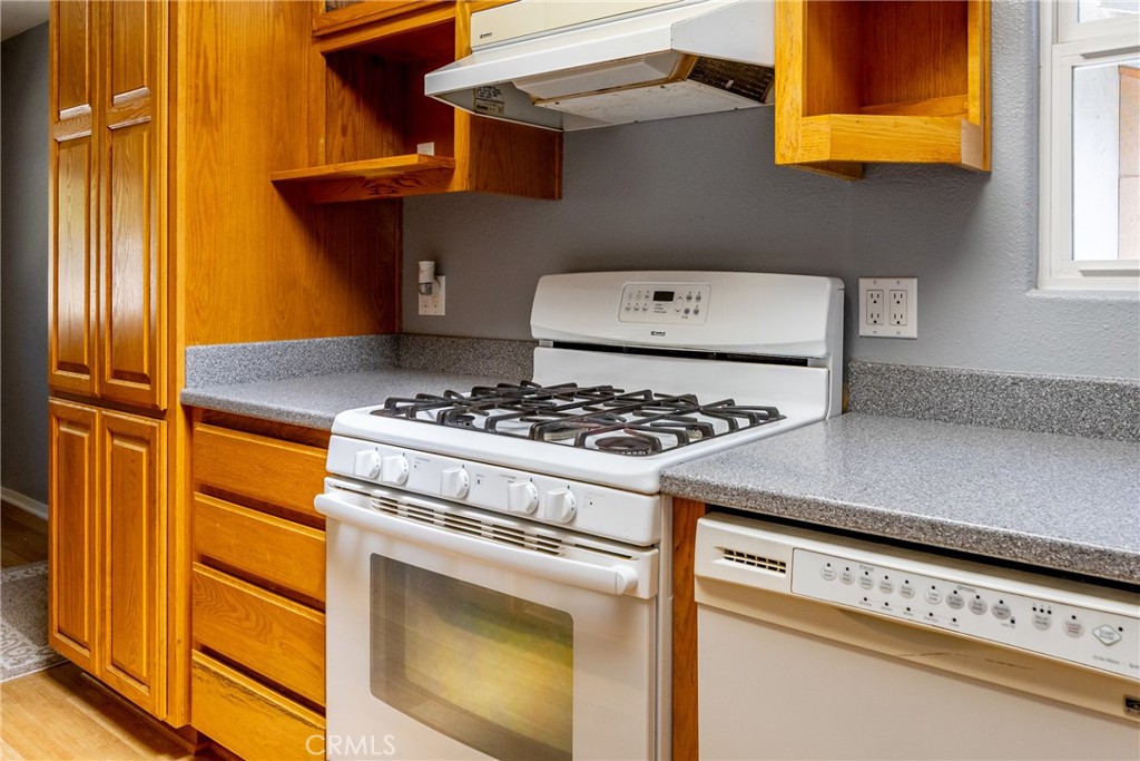 2155 Cowper Street Cambria, CA 93428 - Photo 16 of 35 a kitchen with a stove and a refrigerator