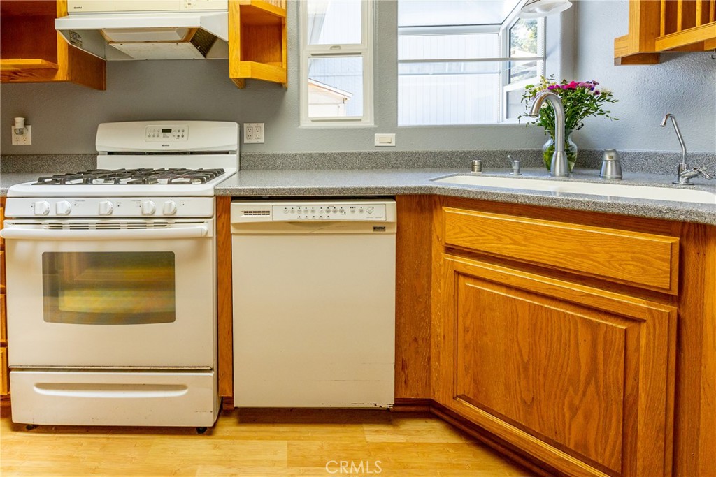 2155 Cowper Street Cambria, CA 93428 - Photo 17 of 35 a kitchen with a stove and a sink