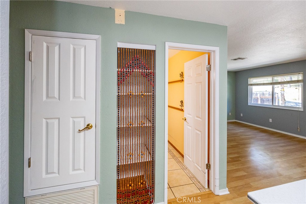 2155 Cowper Street Cambria, CA 93428 - Photo 18 of 35 hallway with wooden floor and windows