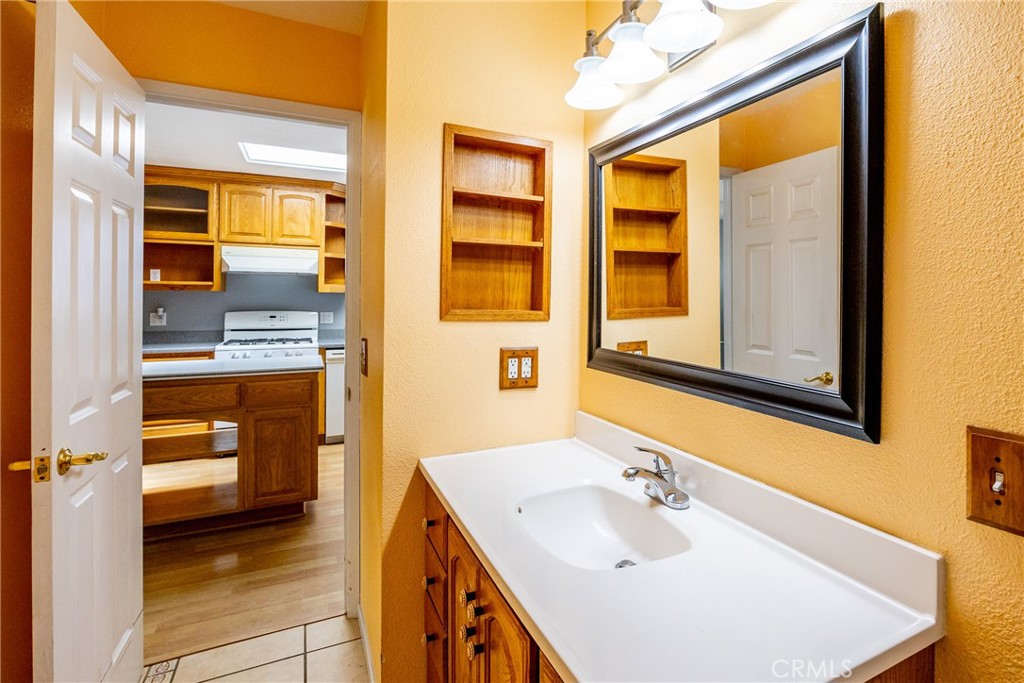 2155 Cowper Street Cambria, CA 93428 - Photo 22 of 35 a en suite bathroom with a sink and a mirror