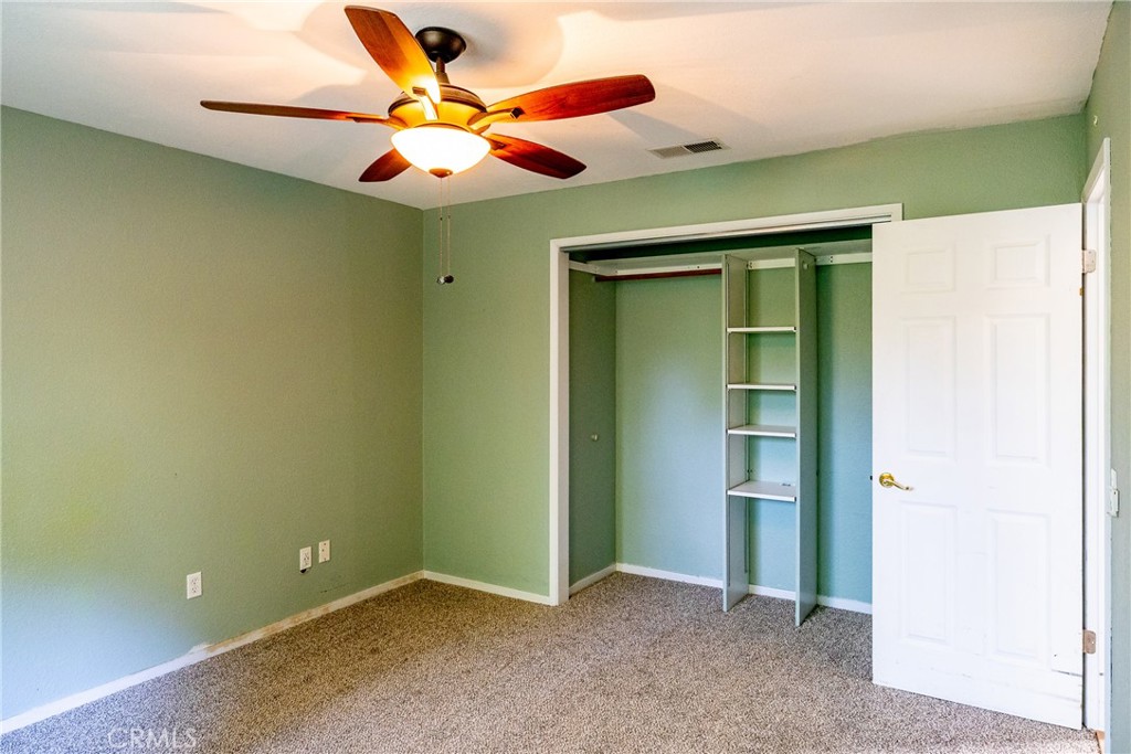 2155 Cowper Street Cambria, CA 93428 - Photo 24 of 35 an empty room with closet and fan