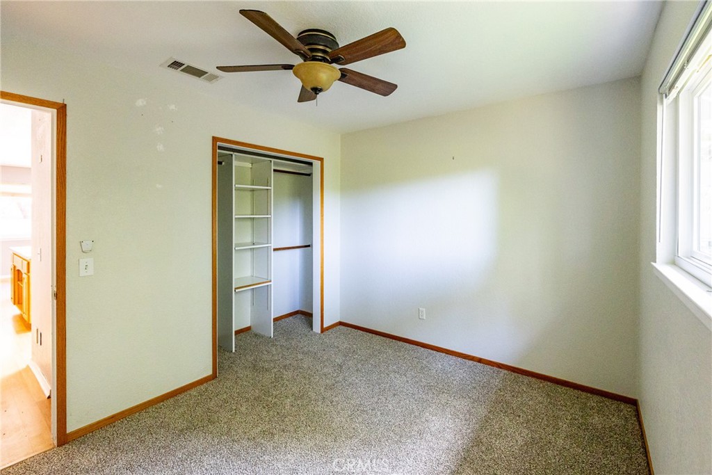 2155 Cowper Street Cambria, CA 93428 - Photo 26 of 35 an empty room with a window and a fan