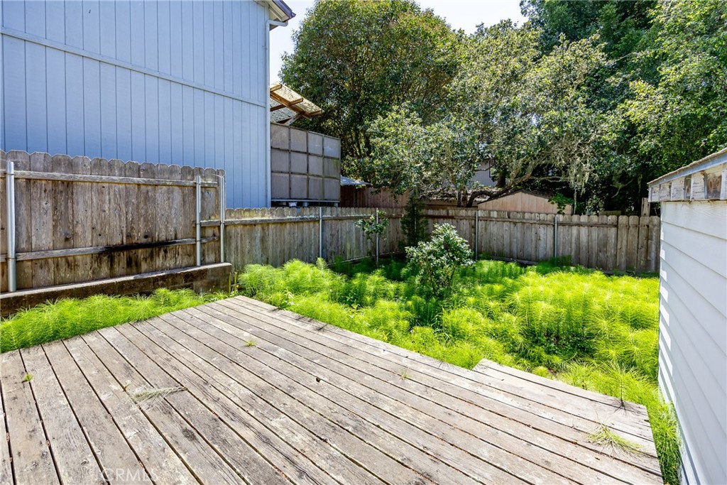 2155 Cowper Street Cambria, CA 93428 - Photo 30 of 35 a view of a backyard with a garden
