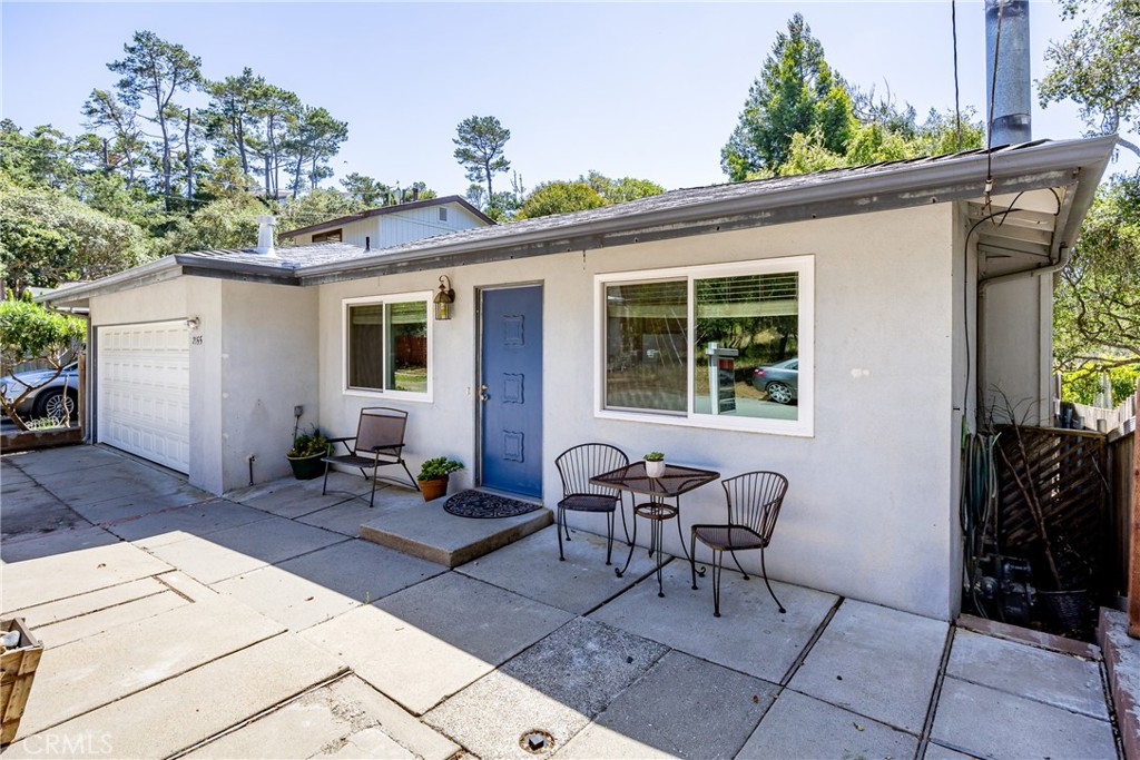2155 Cowper Street Cambria, CA 93428 - Photo 3 of 35 a backyard of a house with outdoor seating