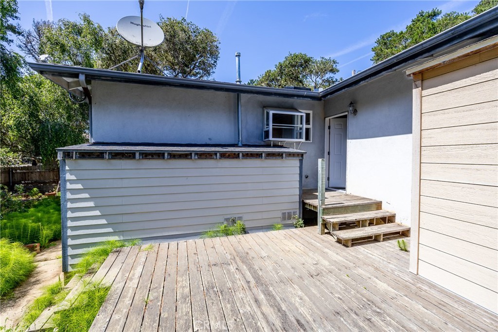 2155 Cowper Street Cambria, CA 93428 - Photo 32 of 35 a backyard of a house with wooden floor and seating space