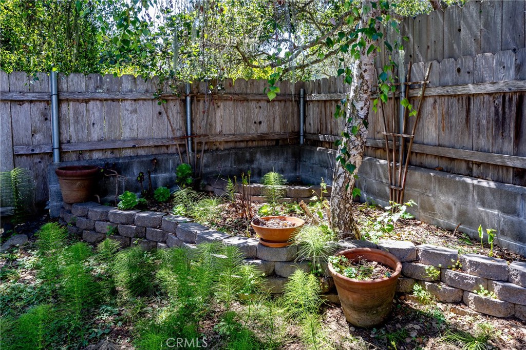 2155 Cowper Street Cambria, CA 93428 - Photo 34 of 35 a view of a backyard with sitting area and fire pit
