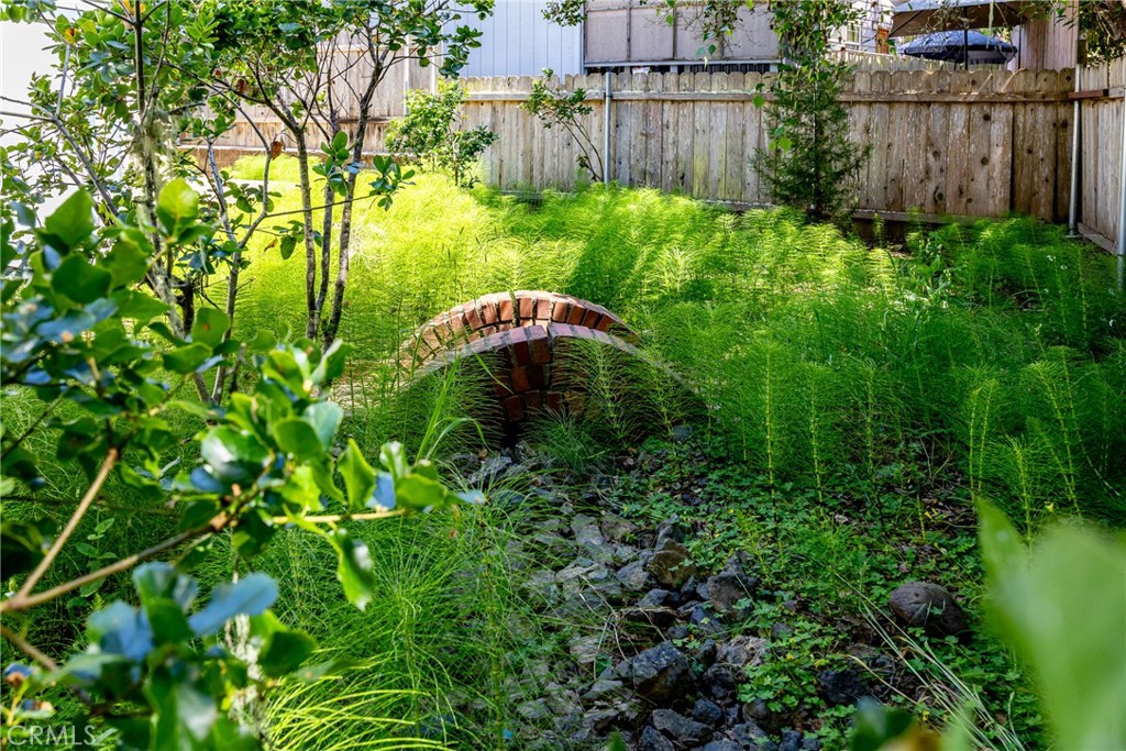 2155 Cowper Street Cambria, CA 93428 - Photo 35 of 35 a backyard of a house with lots of green space