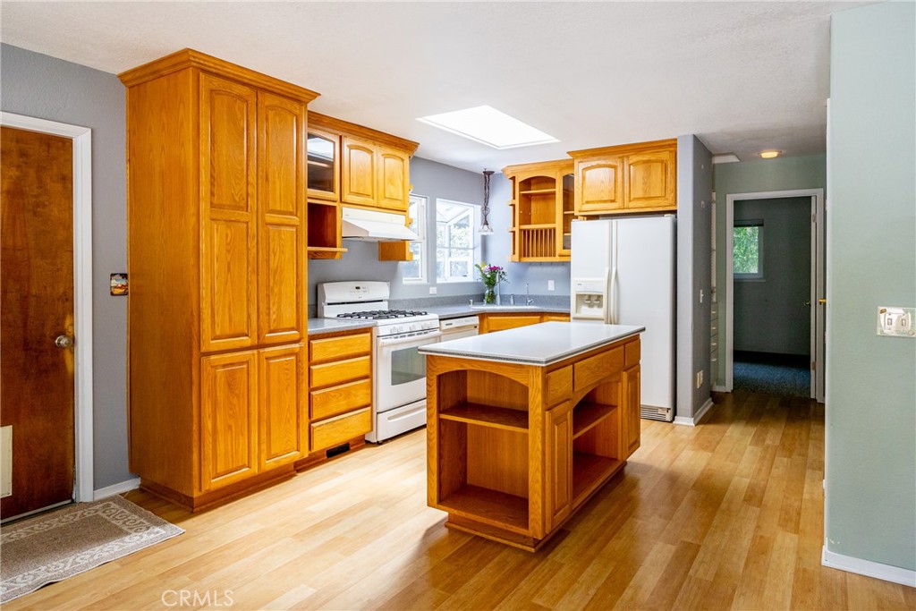 2155 Cowper Street Cambria, CA 93428 - Photo 6 of 35 a kitchen with stainless steel appliances granite countertop a stove and a refrigerator