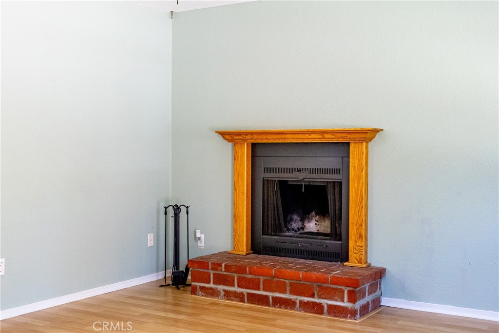 2155 Cowper Street Cambria, CA 93428 - Photo 7 of 35 a room with fireplace and wooden floor