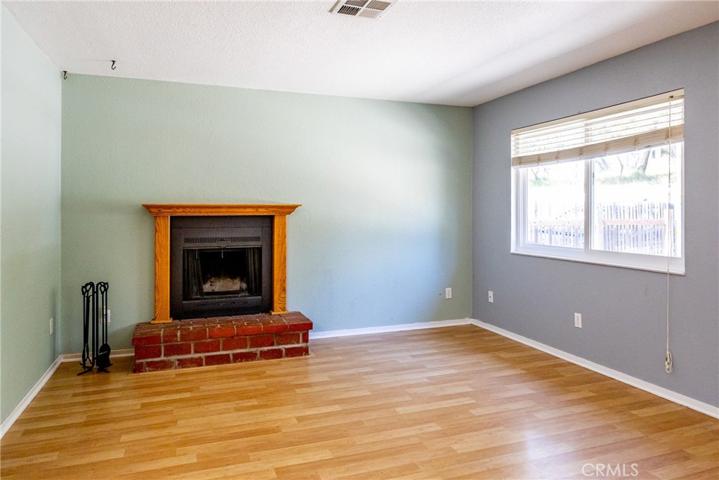 2155 Cowper Street Cambria, CA 93428 - Photo 8 of 35 a room with a fireplace and window