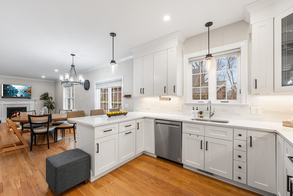 32 Fraser Road Framingham, MA 01702 - Photo 13 of 37 a open kitchen with sink cabinets and wooden floor