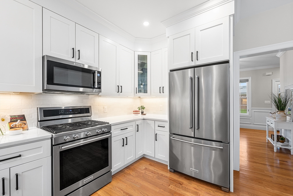 32 Fraser Road Framingham, MA 01702 - Photo 15 of 37 a kitchen with stainless steel appliances a refrigerator stove and microwave