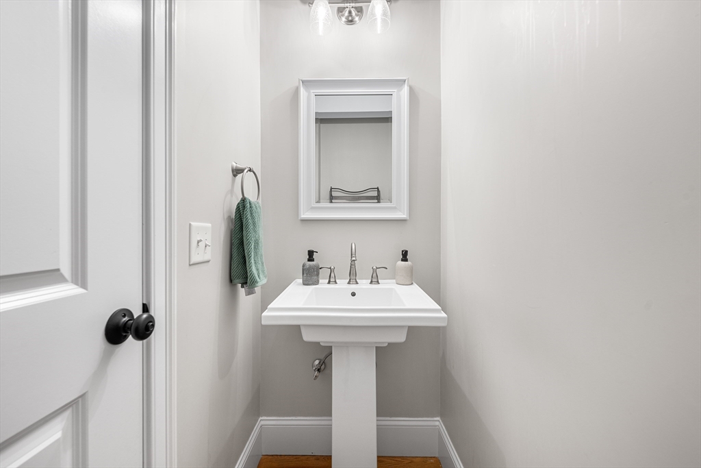 32 Fraser Road Framingham, MA 01702 - Photo 16 of 37 a bathroom with a sink and a mirror