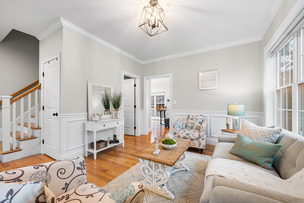 32 Fraser Road Framingham, MA 01702 - Photo 19 of 37 a living room with furniture fireplace and a window