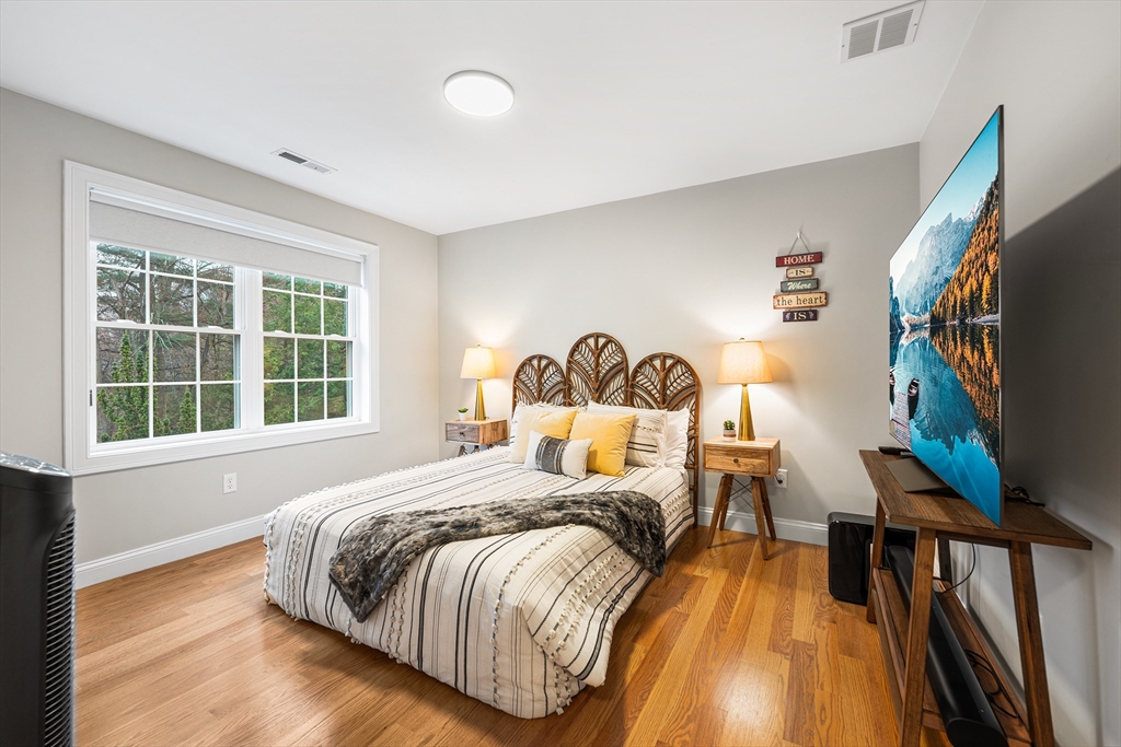 32 Fraser Road Framingham, MA 01702 - Photo 22 of 37 a bed sitting in a bedroom next to a window