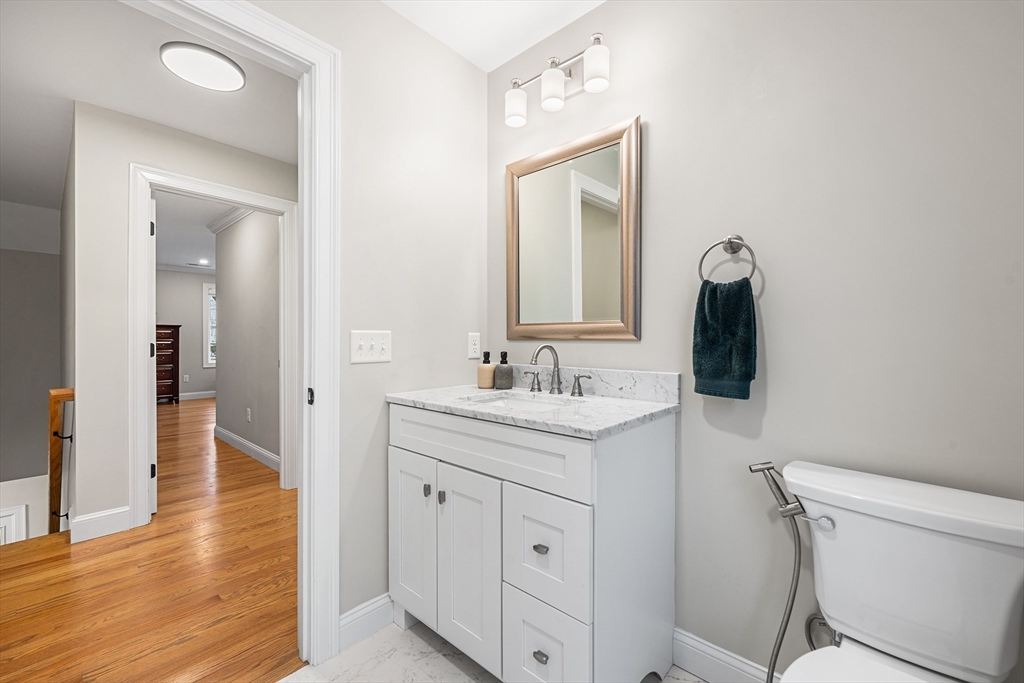 32 Fraser Road Framingham, MA 01702 - Photo 26 of 37 a en suite bathroom with a toilet sink and mirror