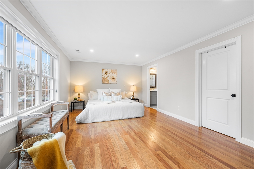 32 Fraser Road Framingham, MA 01702 - Photo 30 of 37 a spacious bedroom with a bed and wooden floor