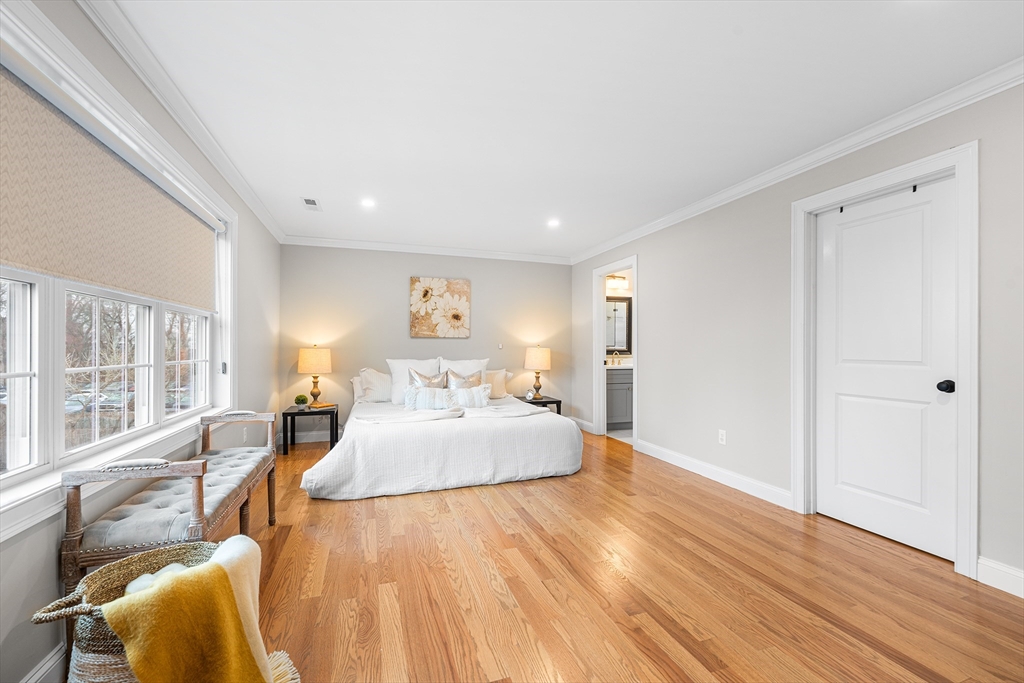 32 Fraser Road Framingham, MA 01702 - Photo 31 of 37 a spacious bedroom with a bed and wooden floor