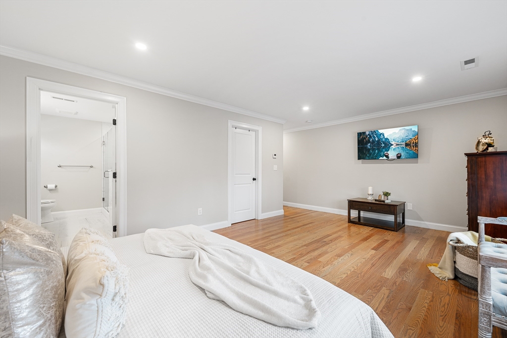 32 Fraser Road Framingham, MA 01702 - Photo 32 of 37 a bedroom with a bed and a workspace