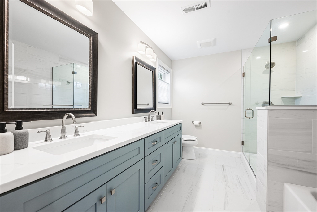 32 Fraser Road Framingham, MA 01702 - Photo 33 of 37 a spacious bathroom with a double vanity sink mirror and double