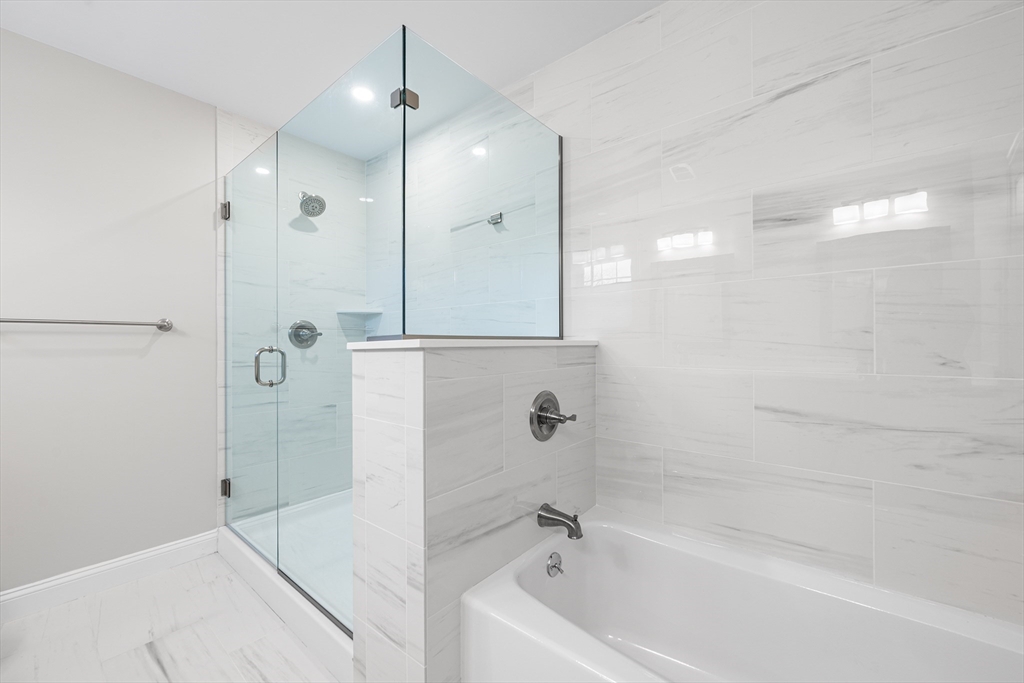 32 Fraser Road Framingham, MA 01702 - Photo 34 of 37 a bathroom with a bathtub and a shower