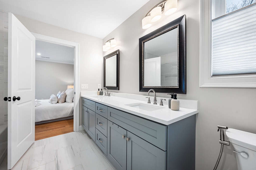 32 Fraser Road Framingham, MA 01702 - Photo 35 of 37 a spacious bathroom with a double vanity sink and mirror