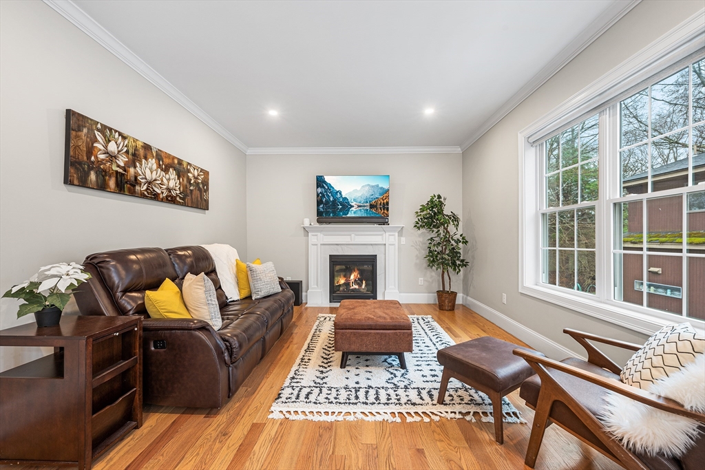 32 Fraser Road Framingham, MA 01702 - Photo 8 of 37 a living room with furniture fireplace and flat screen tv