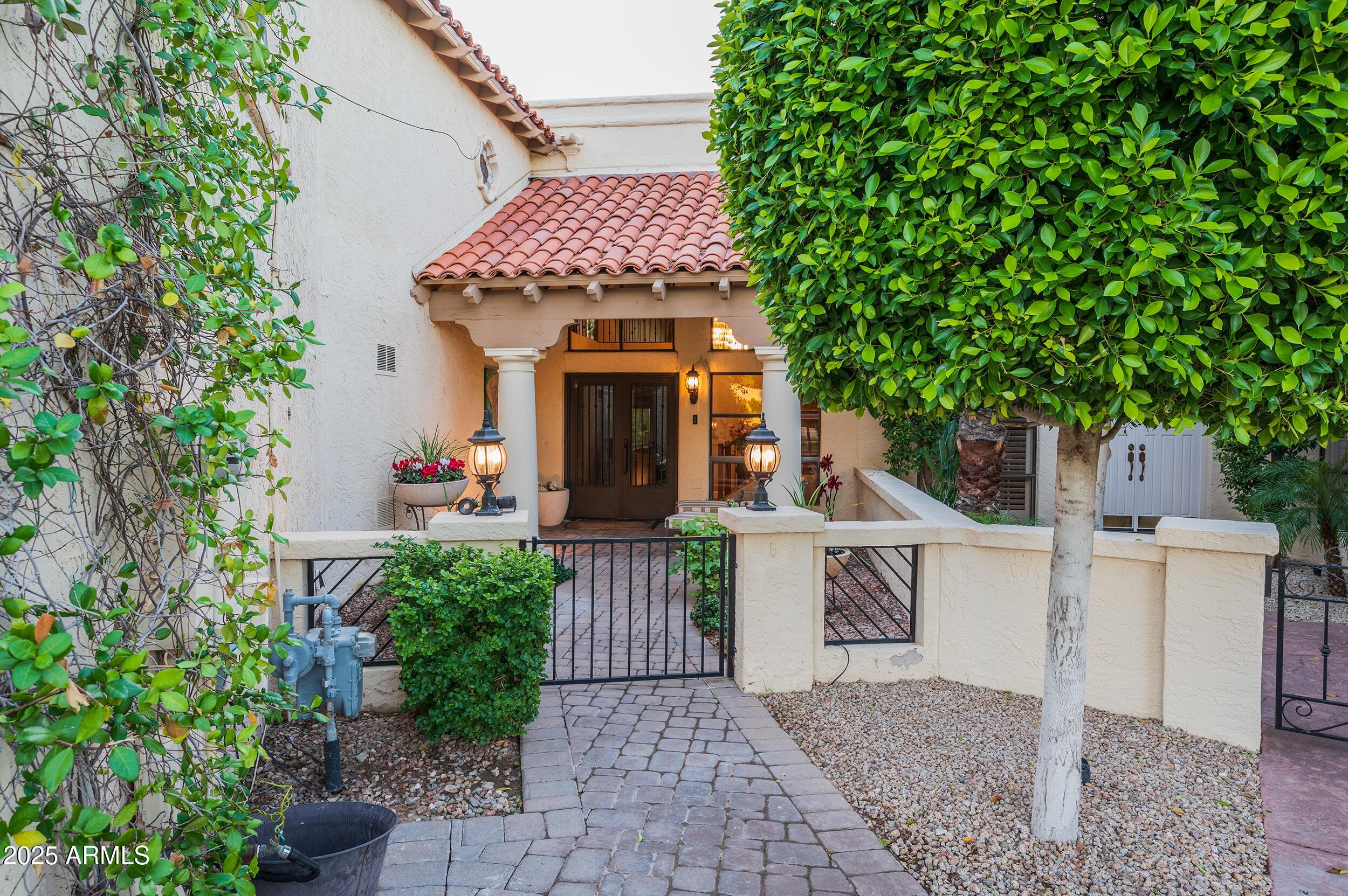 3103 East Georgia Avenue Phoenix, AZ 85016 - Photo 2 of 36 a view of a house with many windows plants and large tree