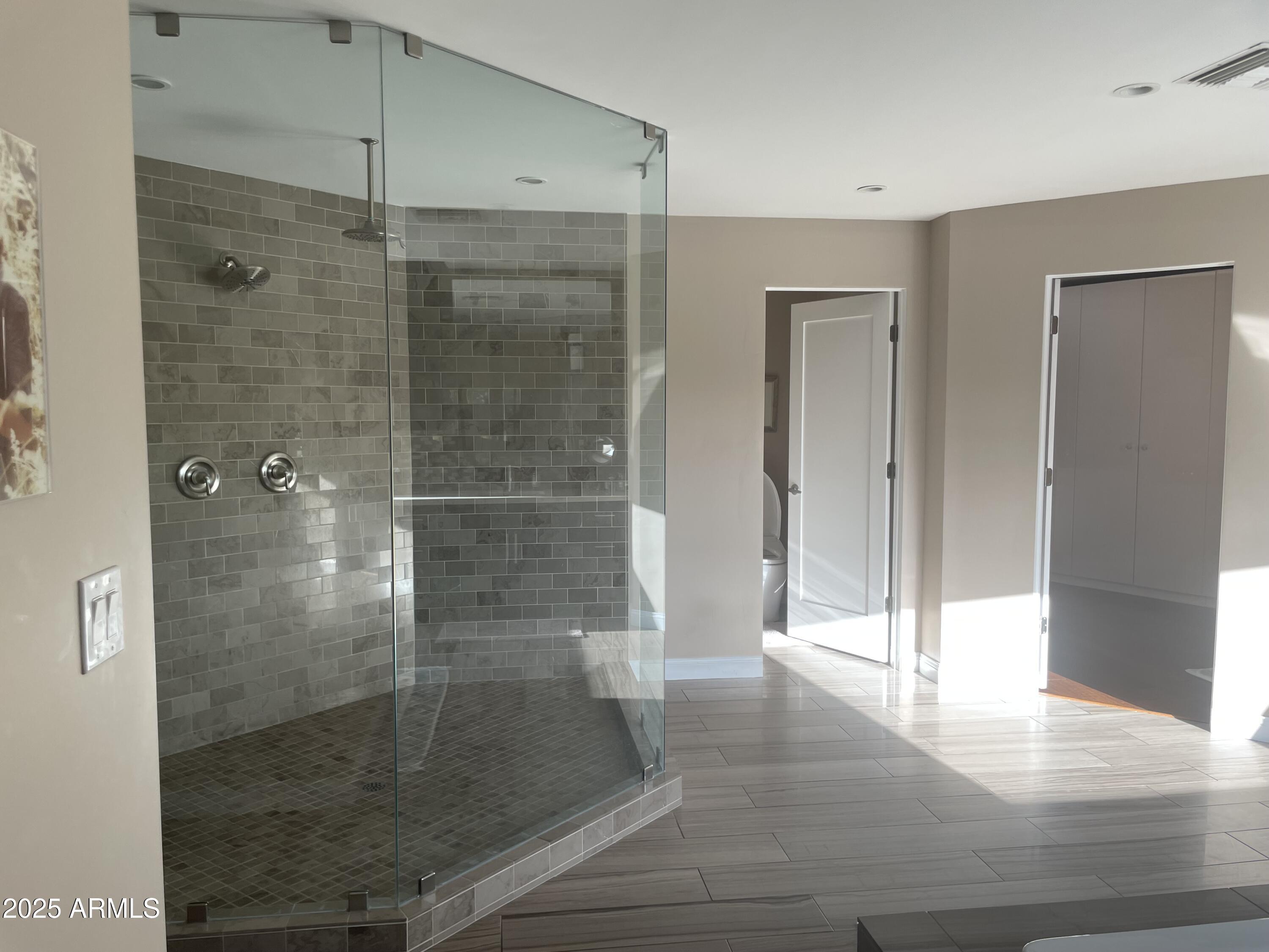 3103 East Georgia Avenue Phoenix, AZ 85016 - Photo 23 of 36 a bathroom with a glass shower door