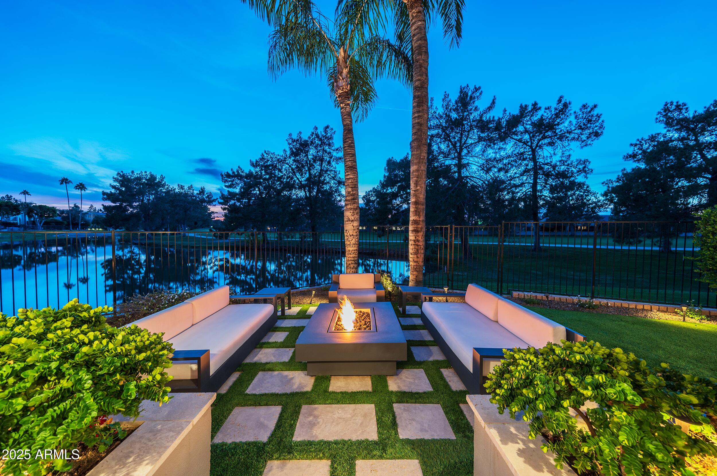 3103 East Georgia Avenue Phoenix, AZ 85016 - Photo 33 of 36 a wooden bench sitting in front of a lake