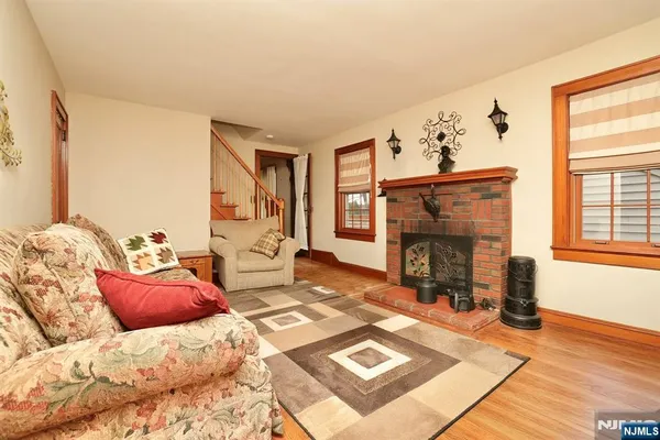 a bedroom with furniture and a fireplace
