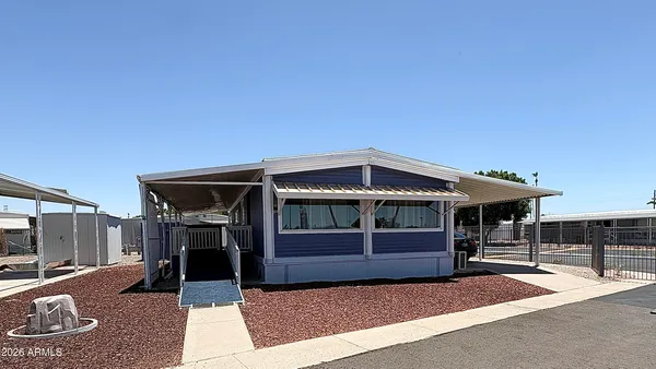 a front view of a house with parking space