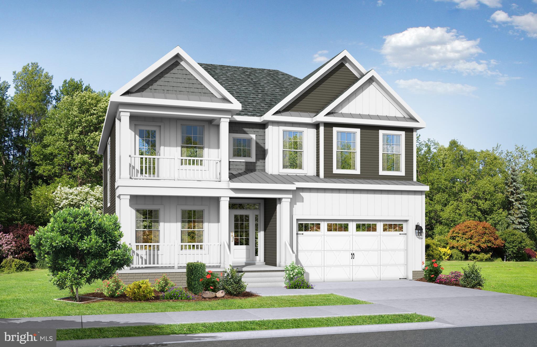 19481 Safflower Way Lewes, DE 19958 - Photo 4 of 6 a front view of a house with a yard