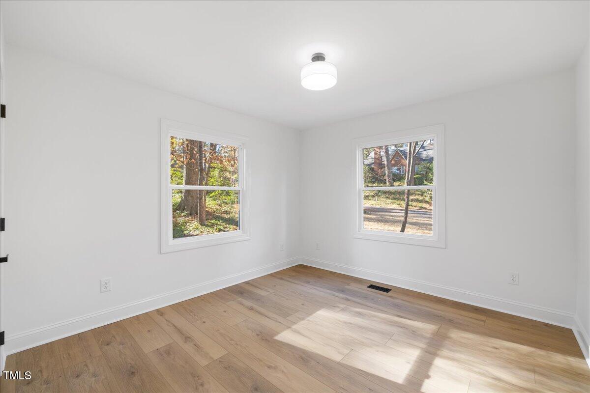 2703 Augusta Drive Durham, NC 27707 - Photo 20 of 45 an empty room with a window
