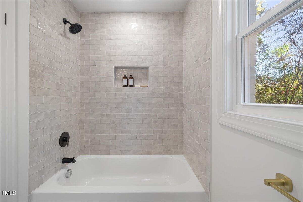 2703 Augusta Drive Durham, NC 27707 - Photo 24 of 45 a bathroom with a bathtub