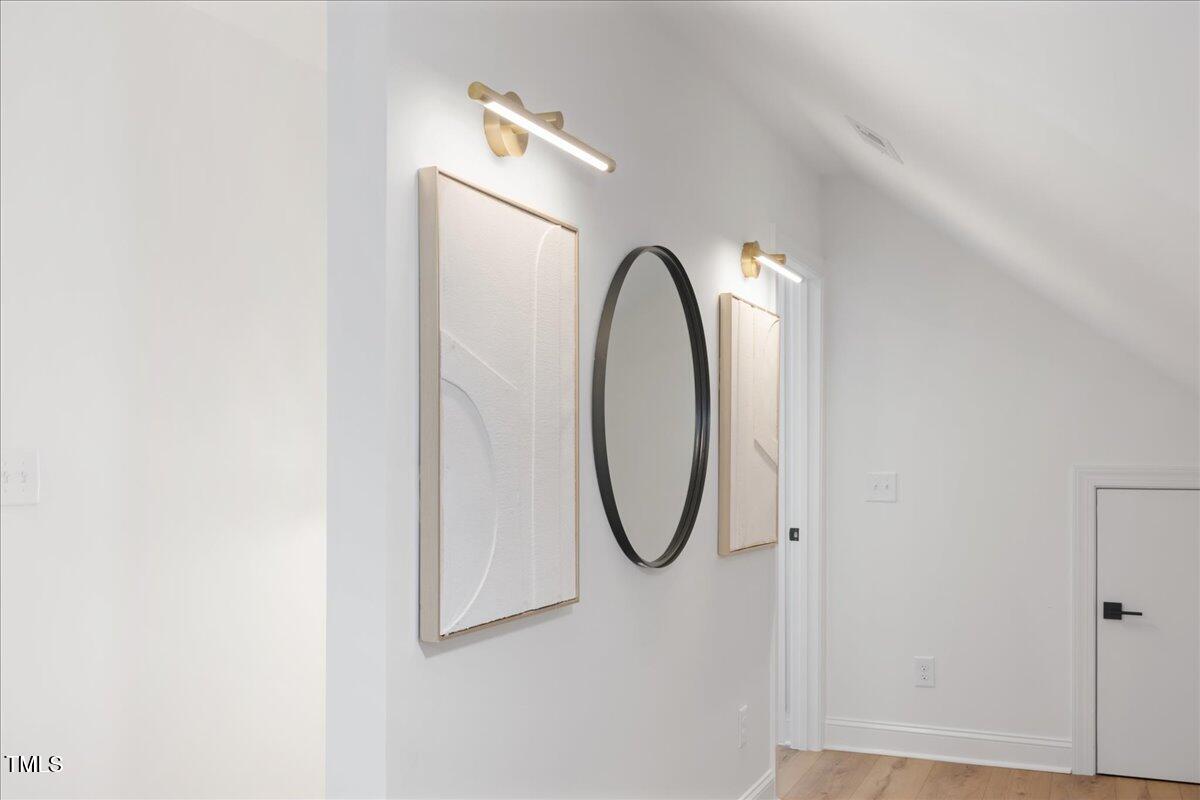 2703 Augusta Drive Durham, NC 27707 - Photo 30 of 45 a close view of light fixtures and a white door